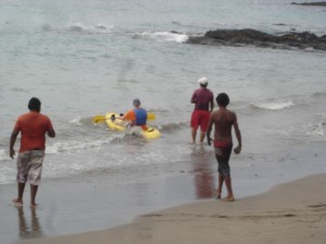 Starting the kayak into the ocean